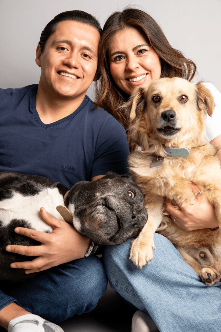 Omar and Maggie Dominguez, founders of PawConscious, with Trufa the French bulldog and Corcho the golden retriever